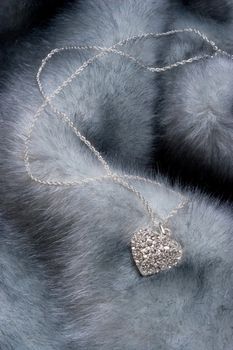 Elegant chain with diamond heart on fur