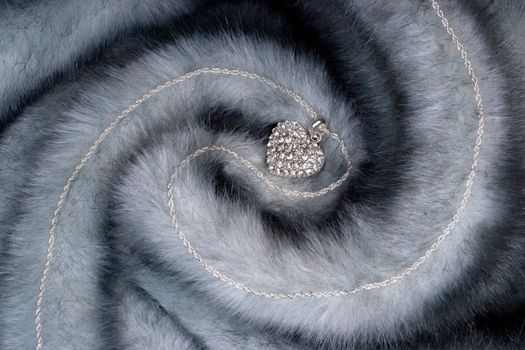 Elegant chain with diamond heart on fur