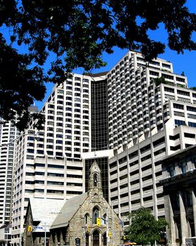 The old architectural style church in the midst of modern buildings 