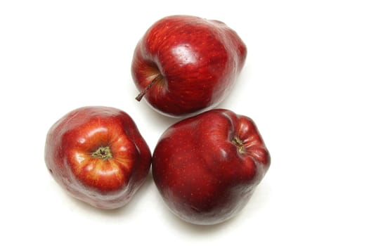 Three red apples isolated on the white background