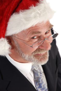 Senior Businessman wearing Santa Claus hat