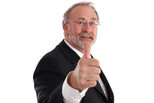 Senior businessman giving the thumbs up. 