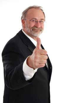 Senior businessman giving the thumbs up.