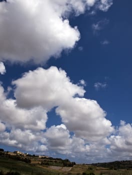 Beautiful sky and clouds over typical valley in Malta