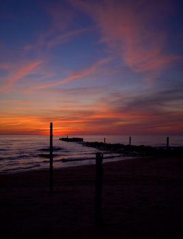 sea sunset baltic sun sky coast clouds
