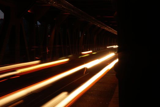 Long exposure of traffic over a bridge at night.