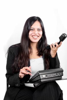 A smiling Indian businesswoman showing a phone without network connection or connecting cables to it.