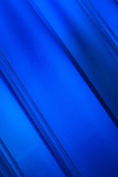 Blue abstract background with diagonal lines
