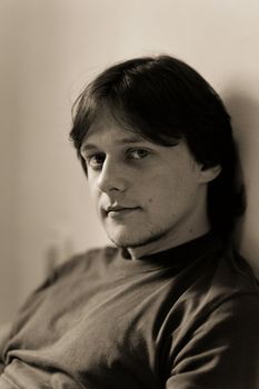 Young man portrait, dark, toned image