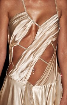 Torso of woman wearing a beautiful evening gown or dress