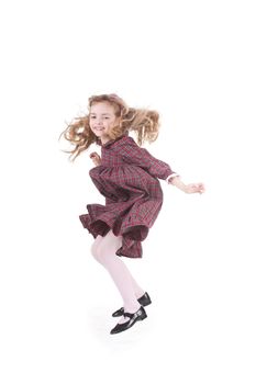 Jumping seven  years old girl in classical dress