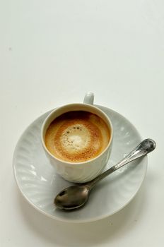 coffee on white cup with spoon