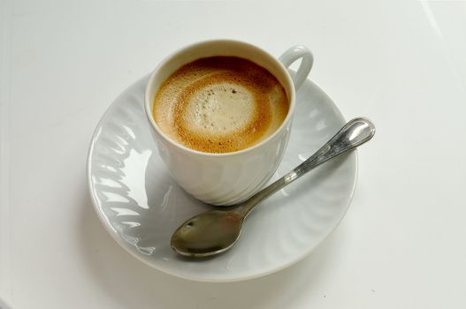 coffee on white cup with spoon