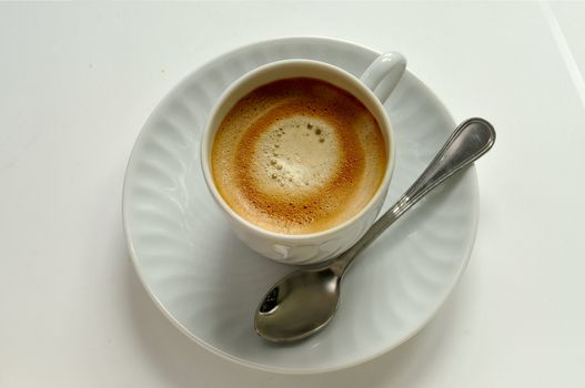 coffee on white cup with spoon