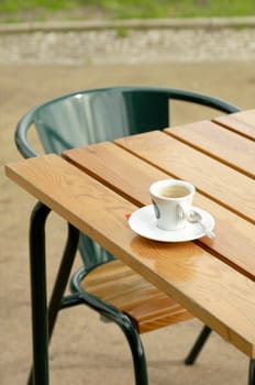 Coffee cup at table at cafe