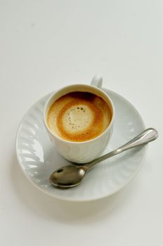 coffee on white cup with spoon