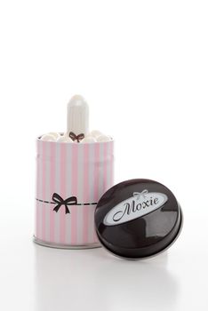 Moxie feminine hygiene tampons in candystripe tin.