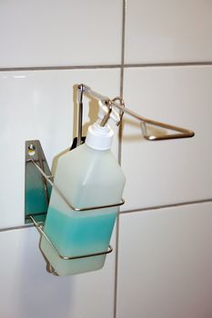 sanitizer filled with blue alcohol gell for hospitals