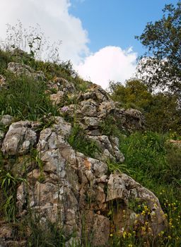 Rocky hill slope in a cloudy day