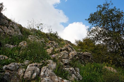 Rocky hill slope in a cloudy day