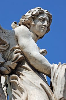 Angel statue on bridge in front at Castel Sant'Angelo in Rome - Best of Italy.