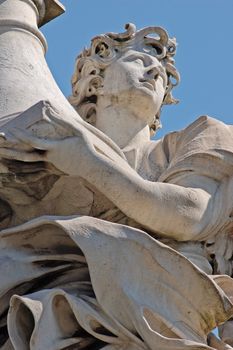 Angel statue on bridge in front at Castel Sant'Angelo in Rome - Best of Italy.