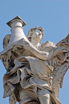 Angel statue on bridge in front at Castel Sant'Angelo in Rome - Best of Italy.