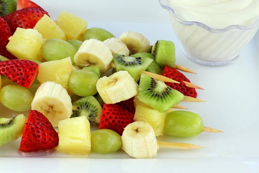 Fresh fruit Kebab made of strawberries, Grapes, kiwis, bananas and pineapples. Shallow Depth of Field