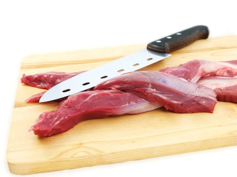 Lamb sirloin steak, raw on a wooden board with a knife