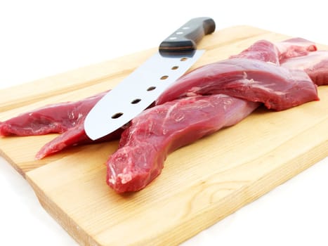 Lamb sirloin steak, raw on a wooden board with a knife