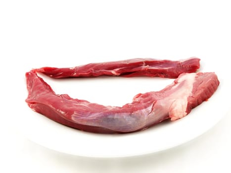 Raw red meat towards white background