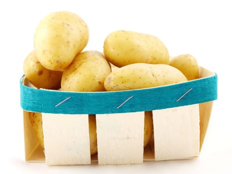 Fresh potatos with shell, in a basket towards white background