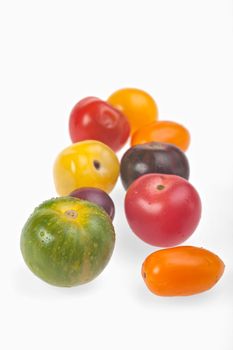 different tomatoes isolated on white background