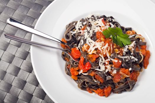 sepia colored tagliatelle with tomato sauce