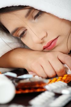 Sick young woman in bathrobe