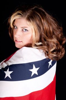 A sexy American woman wrapped in patriotism.