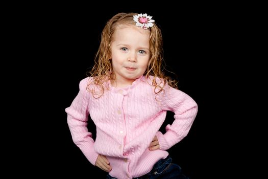 Fashionable young child with her hands on her hipps.