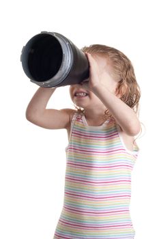 A girl looking through a cone.  She is spotting something in the distance.