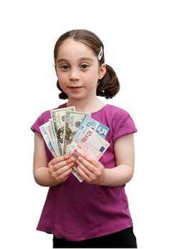 Smiling seven years girl with pigtails holds a fan of banknotes