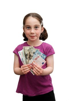 Smiling seven years girl with pigtails holds a fan of banknotes