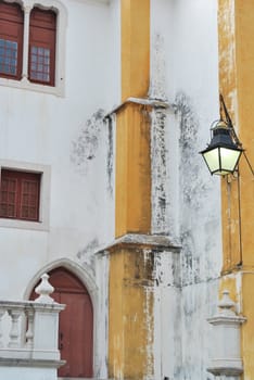 detail of a old church with a antique lamp