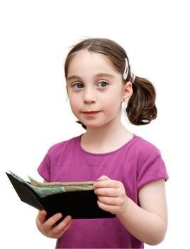 Smiling seven years girl with pigtails holds a wallet with money