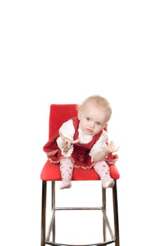 Closeup portrait of little girl sitting on the chair
