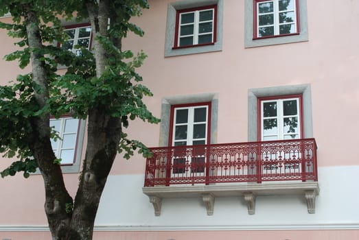 photo of a traditional and mended pink building