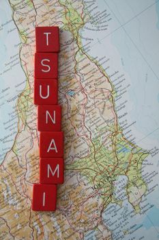 Tsunami in Japan, map of Japan with Tsunami spelled in red letters