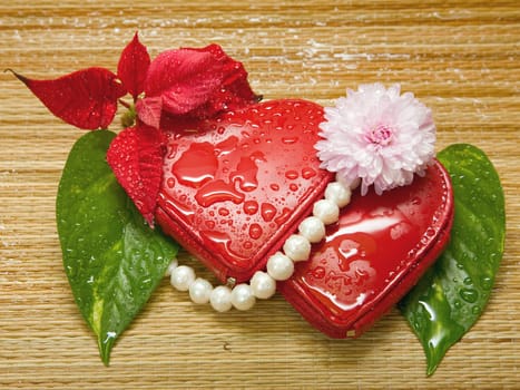 two hearts with green leaves and pink chrysanthemum