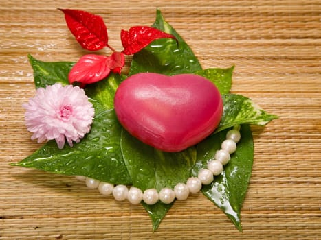 heart with green leaves, pink chrysanthemum and pearl