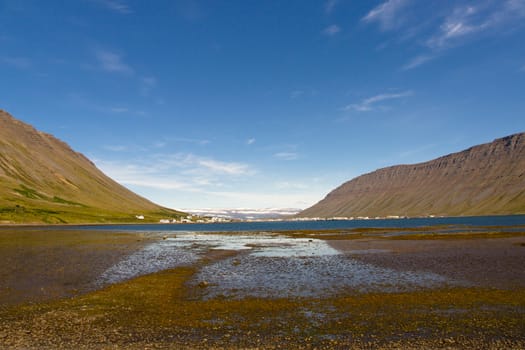 Iceland in background Isafjordur  town. Summer sunny day.