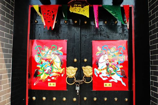 Closeup of a traditonal Chinese door decorated for the Chinese new year
