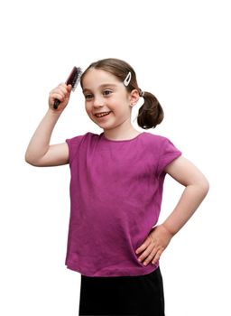 Cute seven years girl with pigtails brush her hair on white background